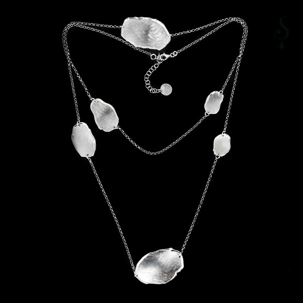 Long necklace of sterling silver with a few irregular, oval and closed links