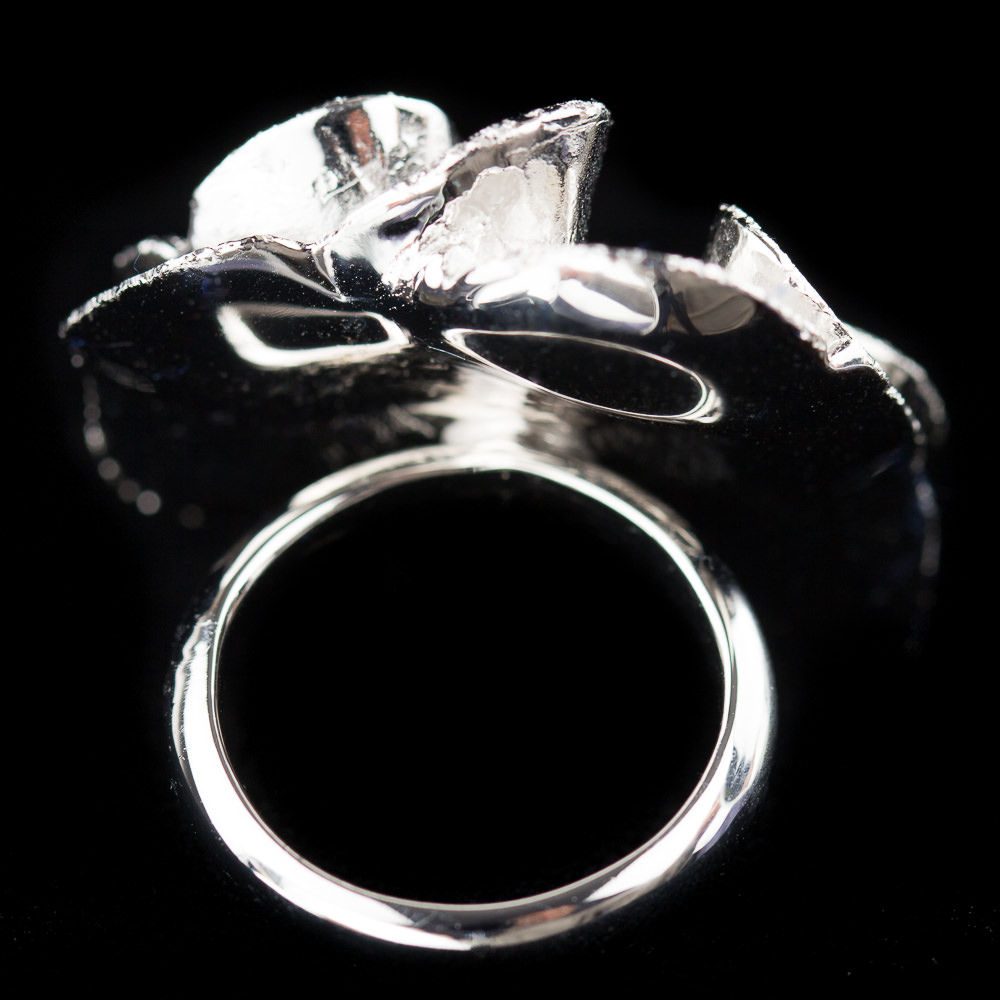 OGI0217004 - Zilveren bloemring, krulvormig en gediamanteerd