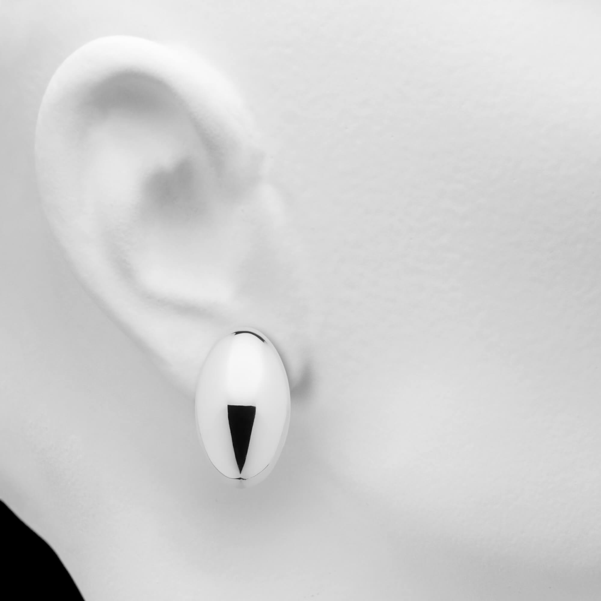 Sleek silver polished oval earrings