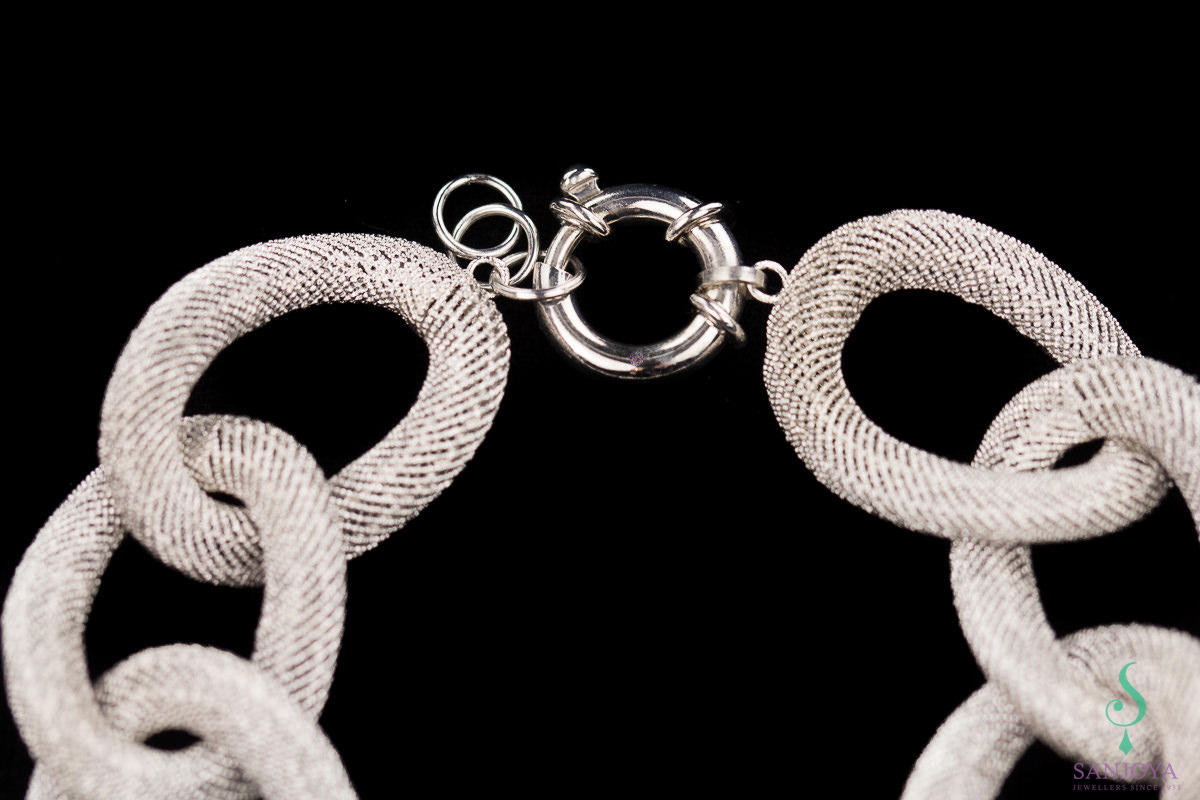 Wide silver link bracelet with beautiful transparent pattern