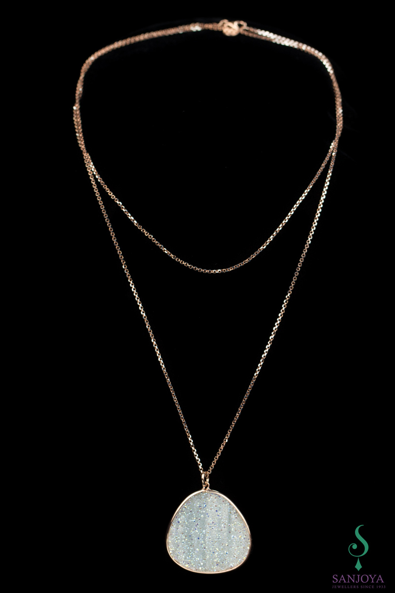 Long necklace with large pendant of rosé and white crystals