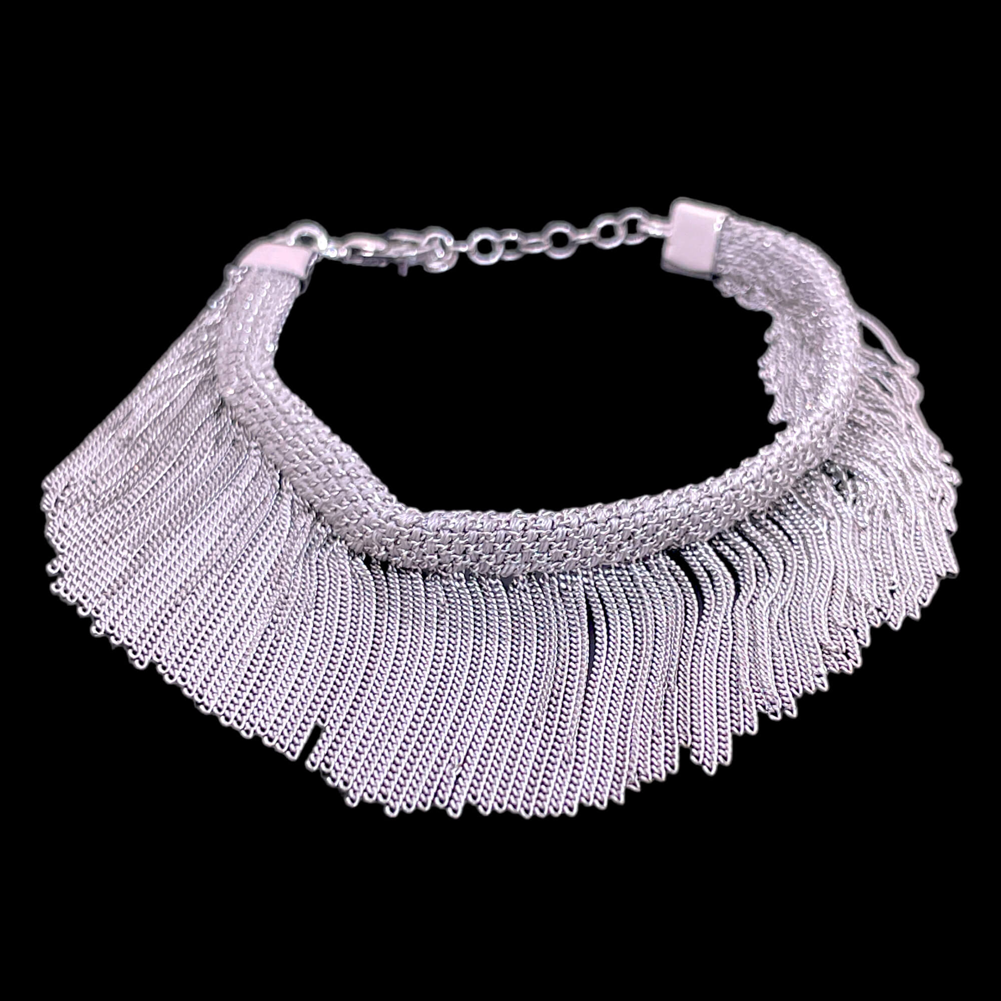 Silver colored bracelet with hanging chains