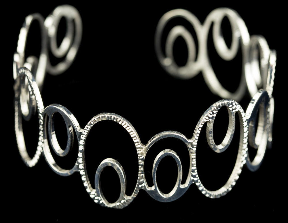 Silver oval-shaped slave bracelet