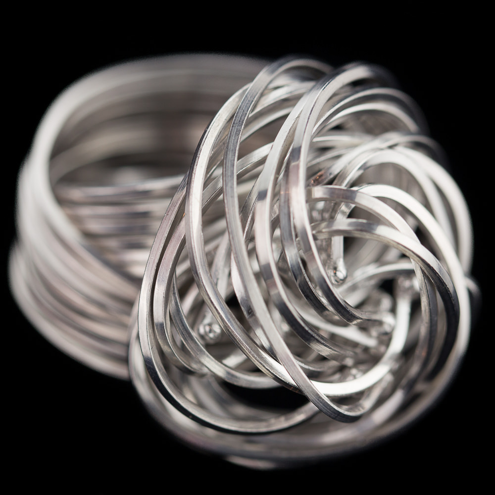 Elegant stiff multi-wire curl ring of sterling silver