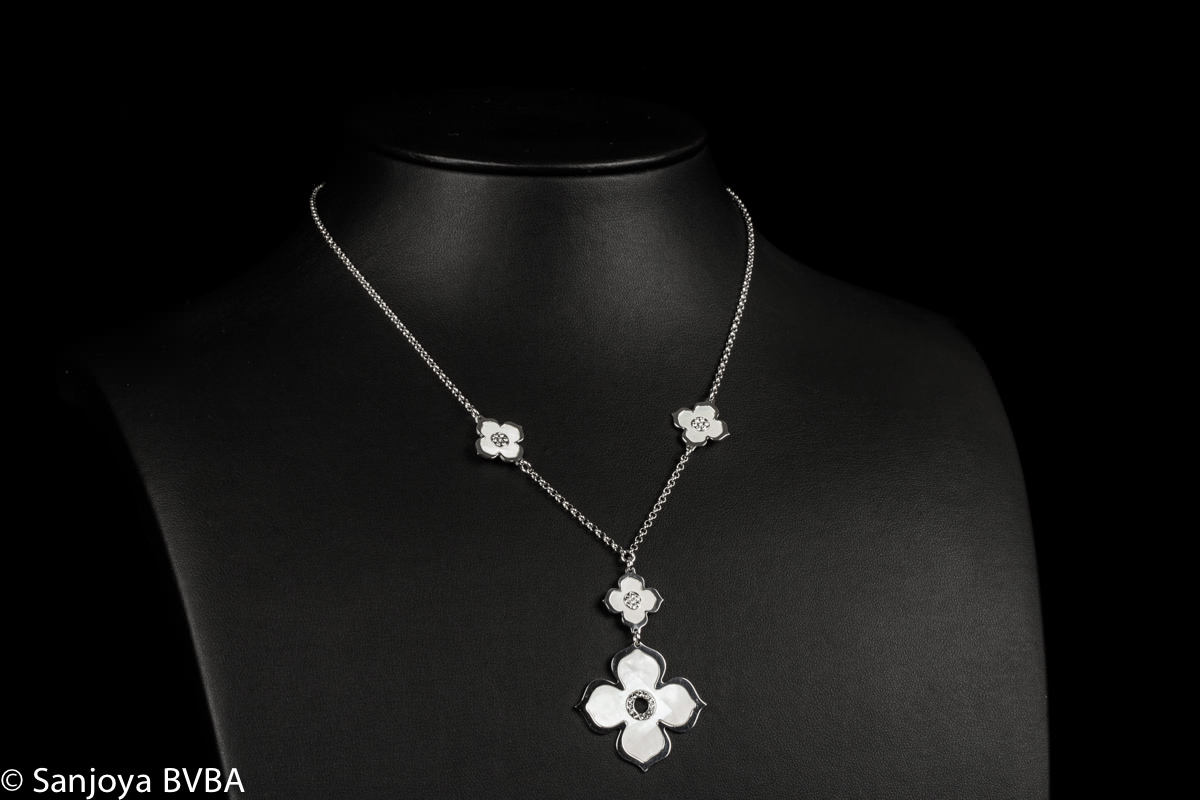 Silver necklace with flowers and decorated pendant