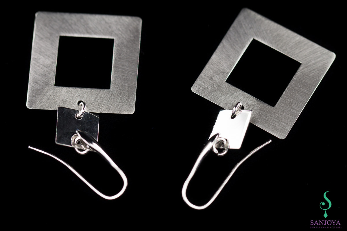 Silver earrings. drooping and square