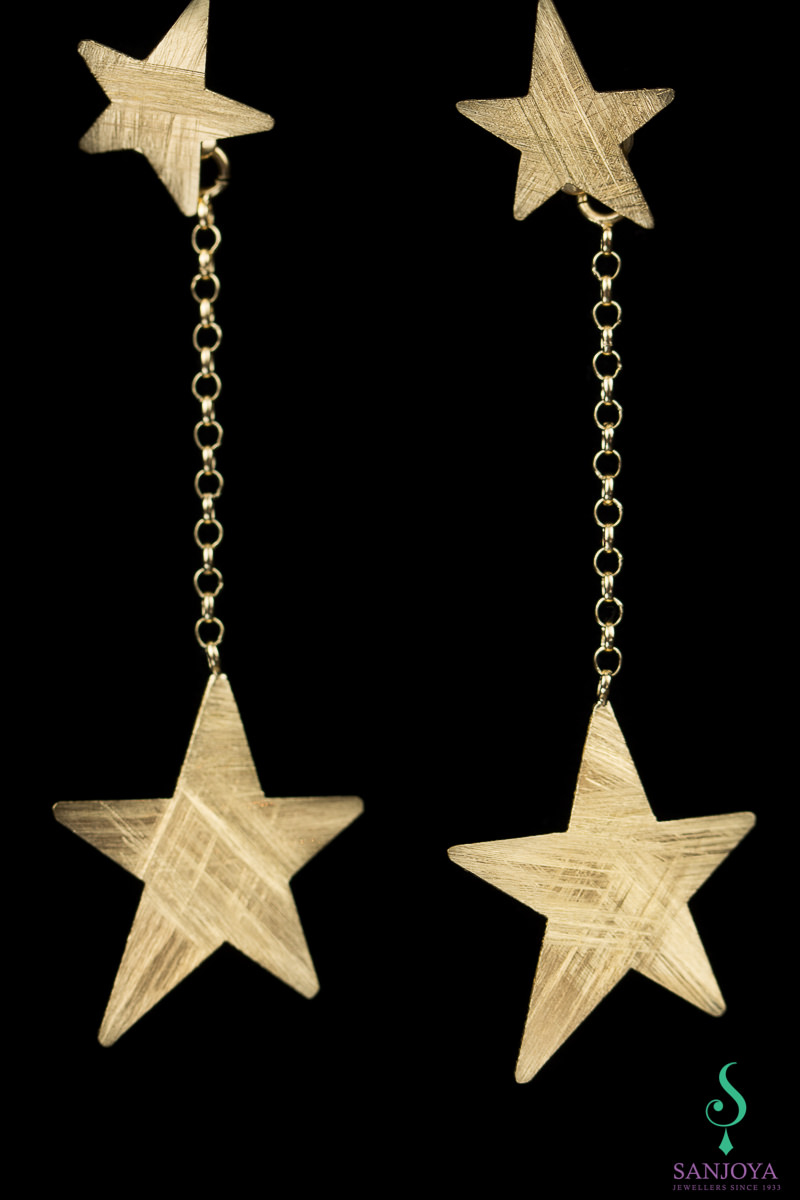 Long gold plated earrings with matte stars