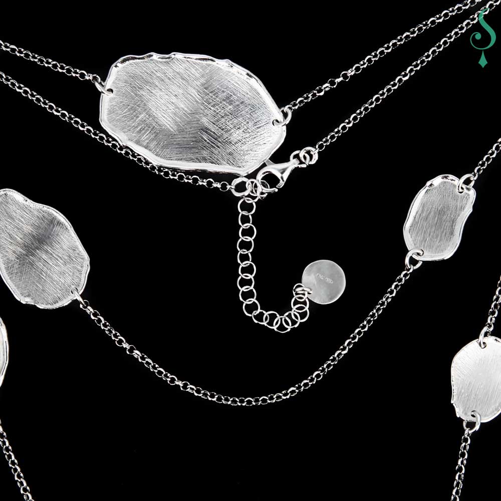 Long necklace of sterling silver with a few irregular, oval and closed links