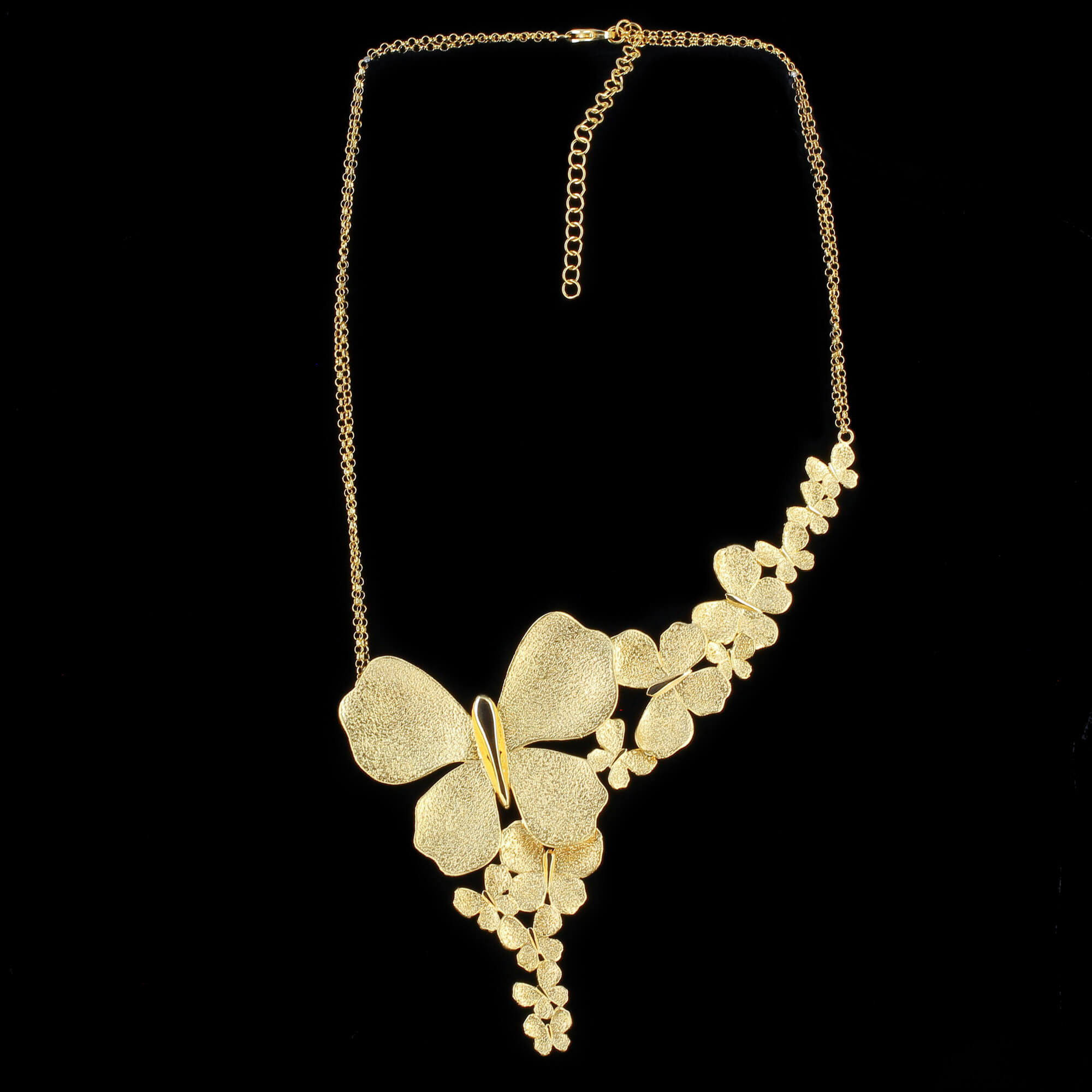 Gilded necklace with a few butterflies