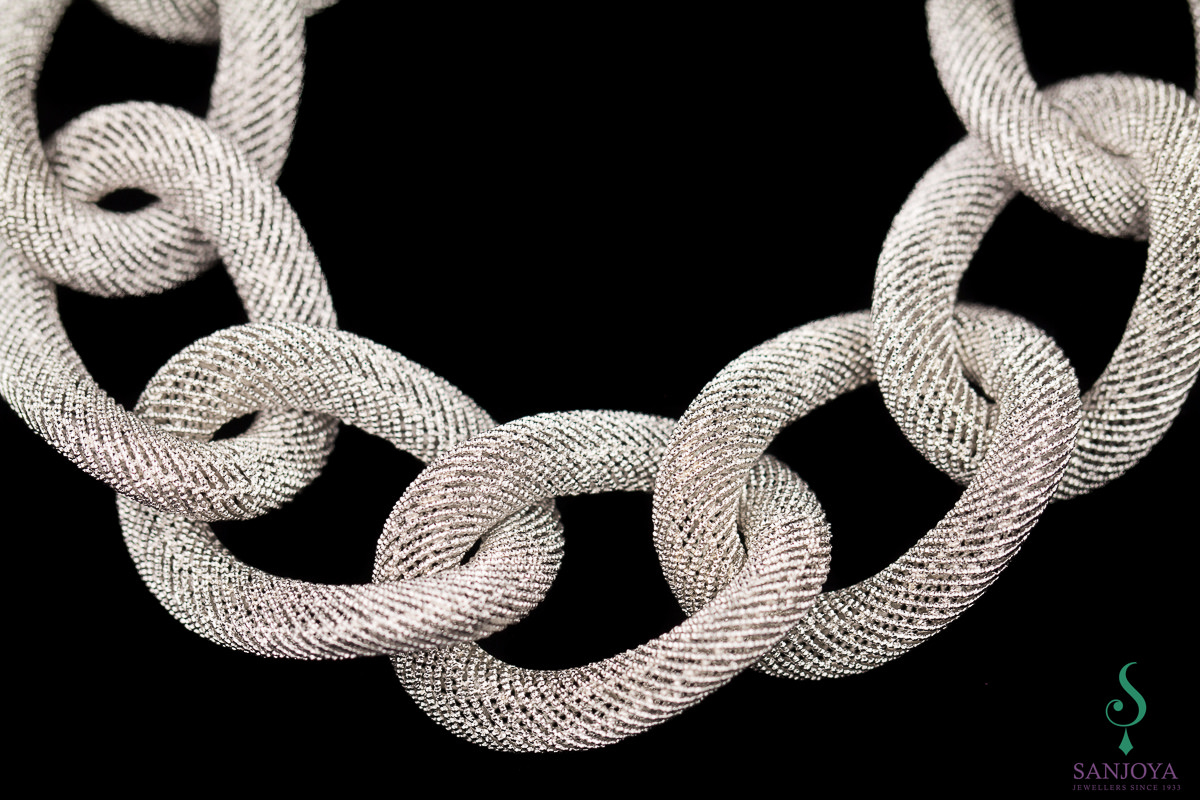 Wide silver link bracelet with beautiful transparent pattern