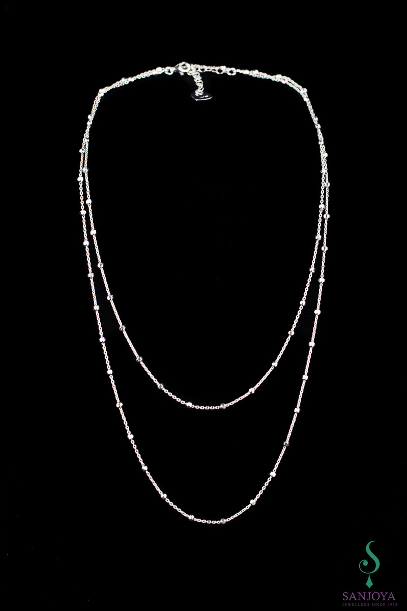 Long necklace with some small glittering balls