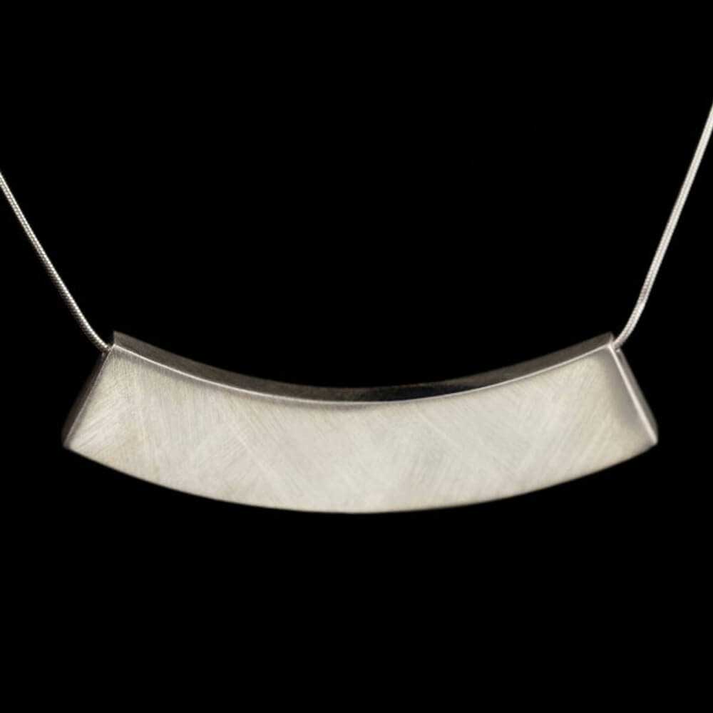 Silver necklace with a sleek and long pendant