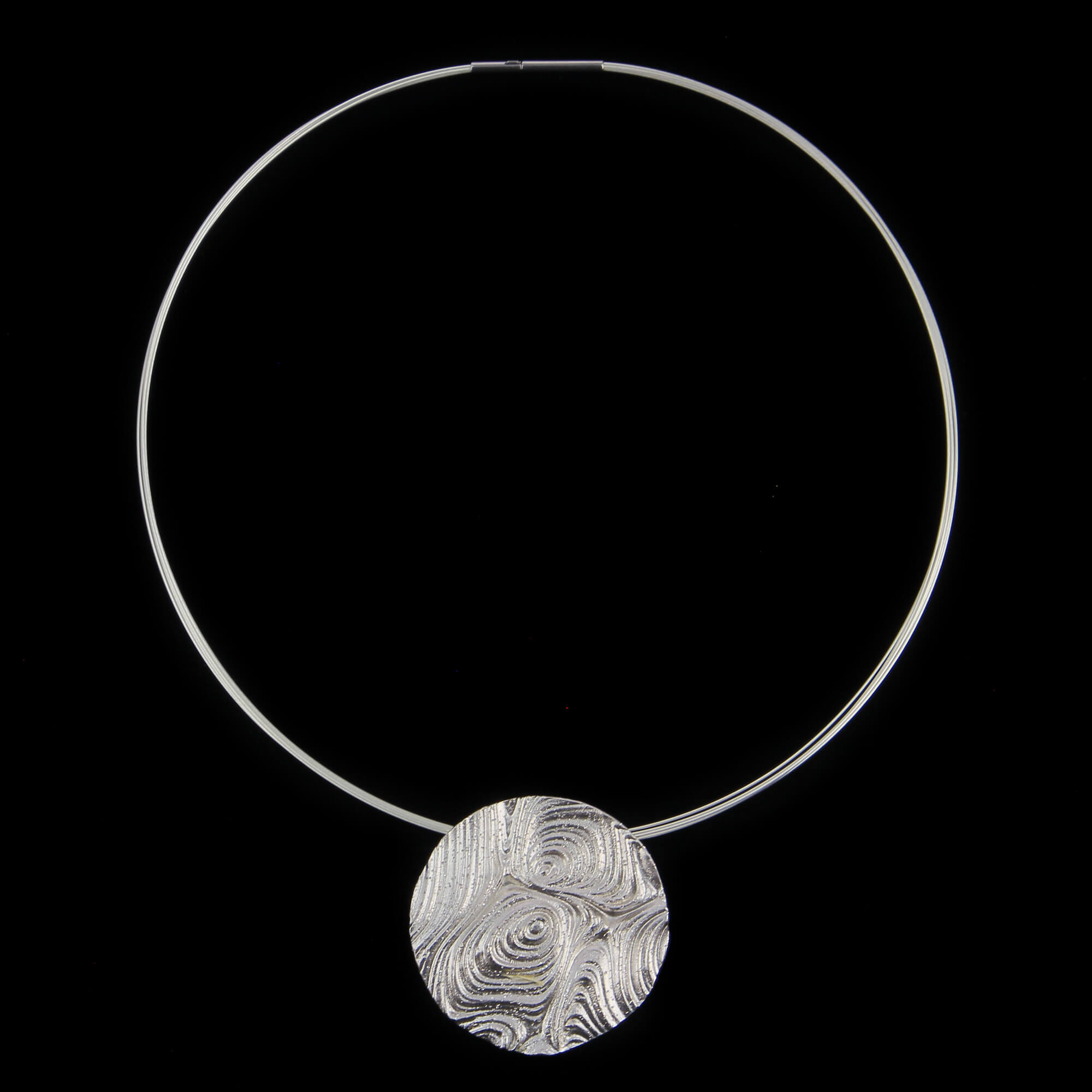 Decorated round silver pendant