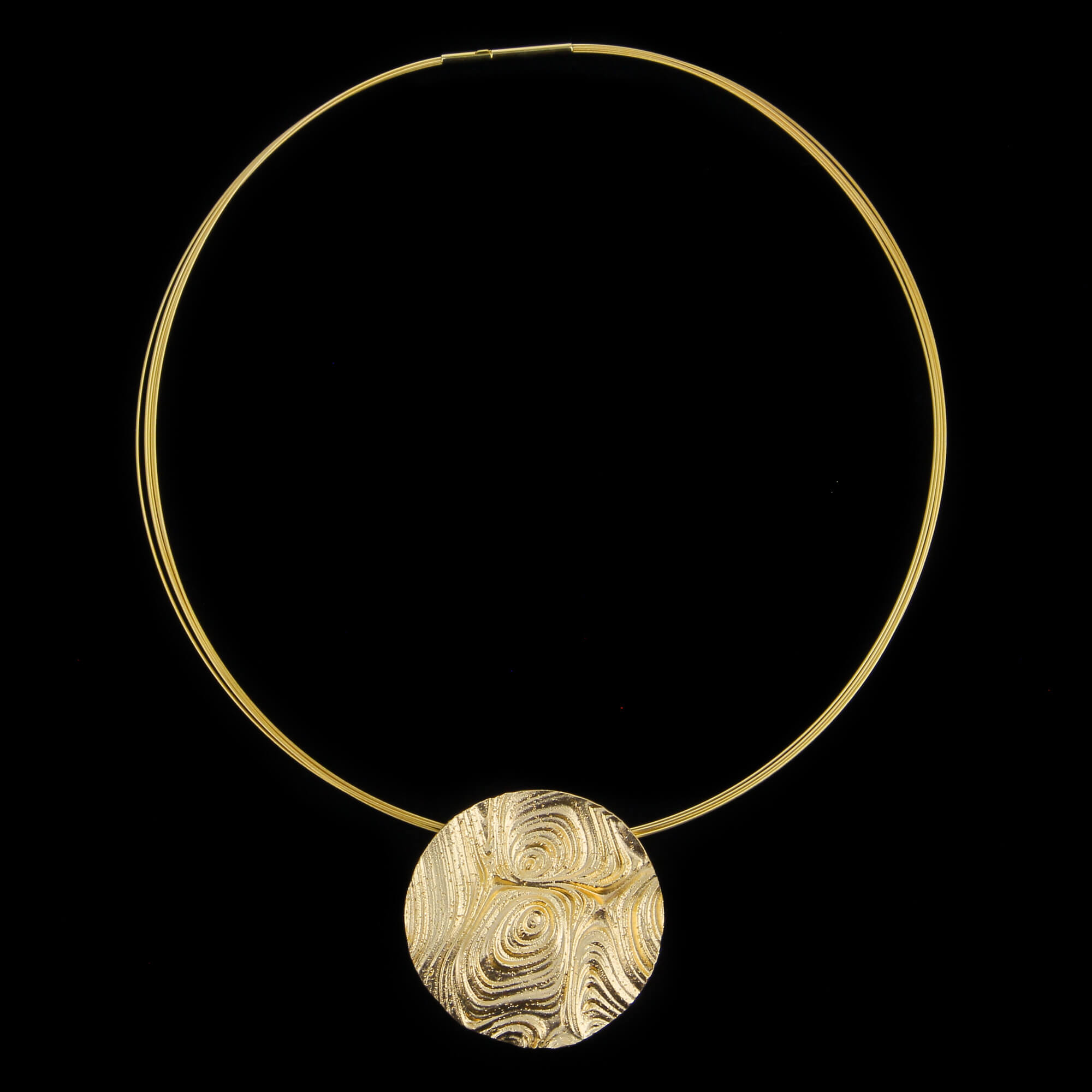 Decorated round pendant made of gold-plated silver