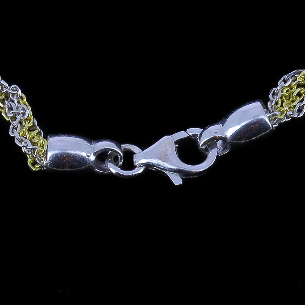 Two-tone woven bracelet of silver and gold