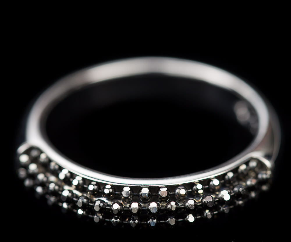 Silver ring with black sparkles