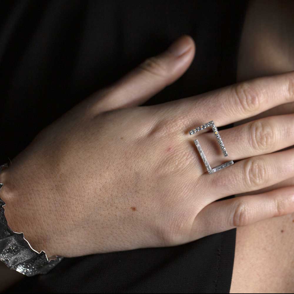 Rectangular ring of silver and zirconia