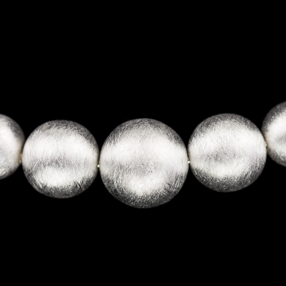 Silver necklace of smaller and larger balls