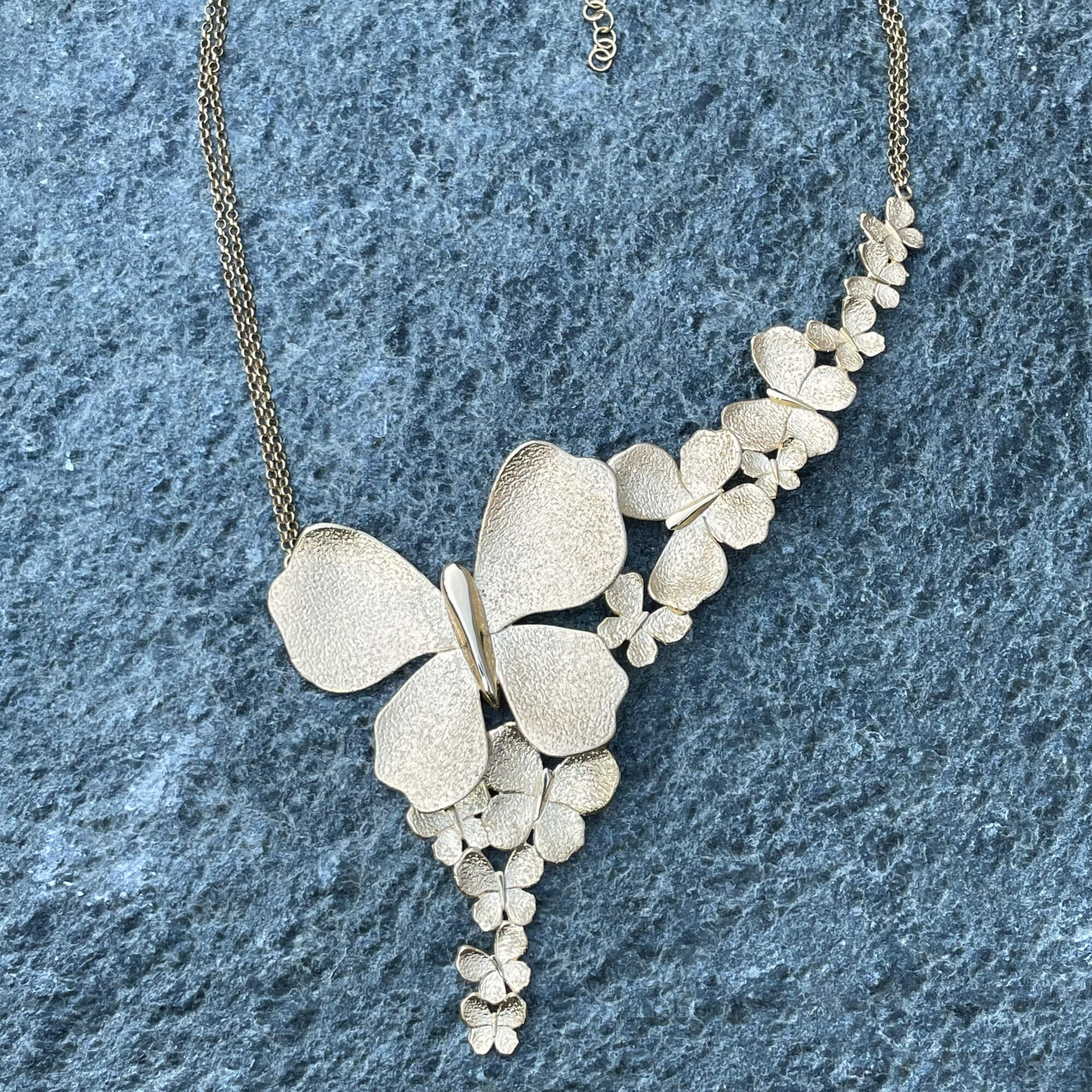 Gold plated necklace with a few butterflies