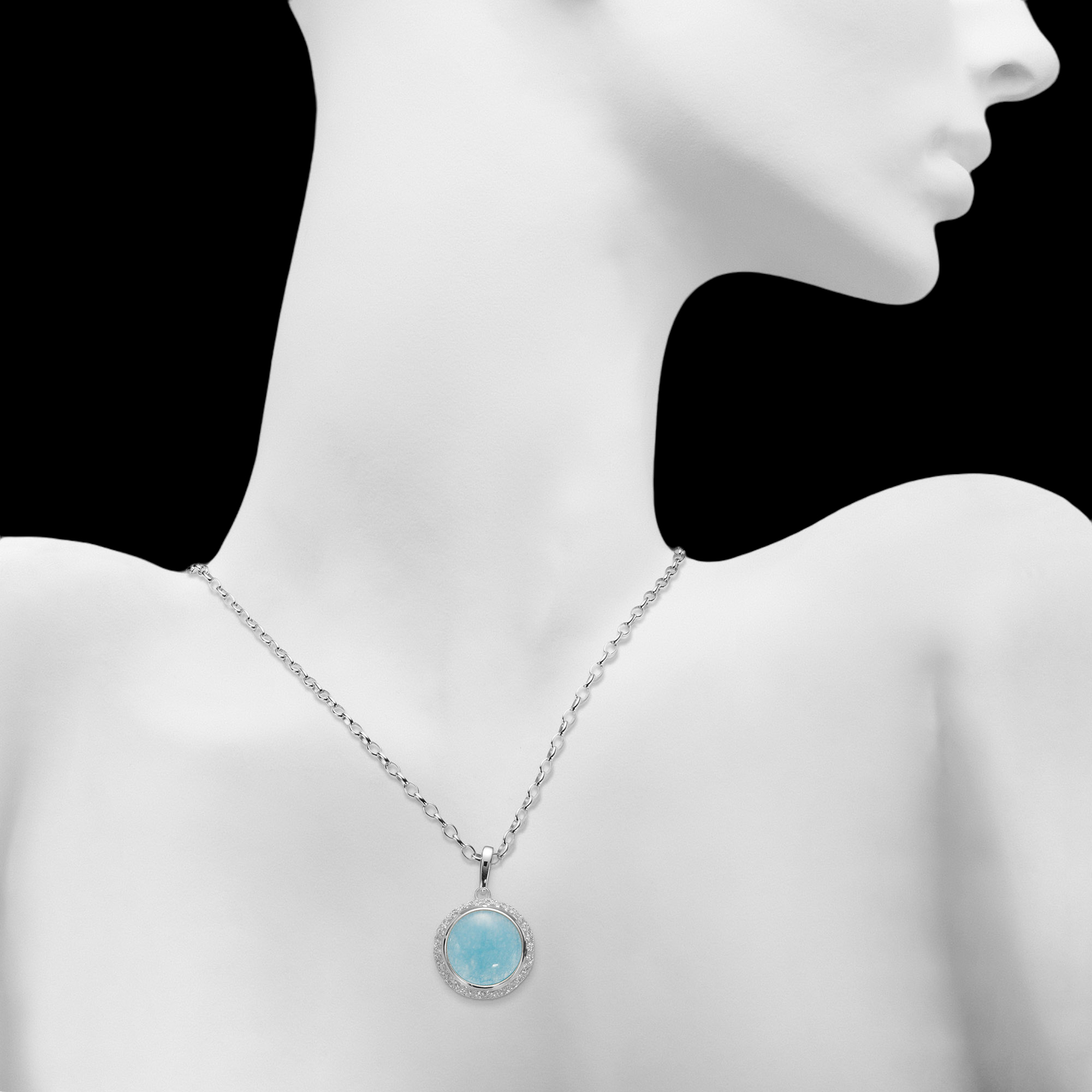 Worked silver pendant with a blue quartz stone