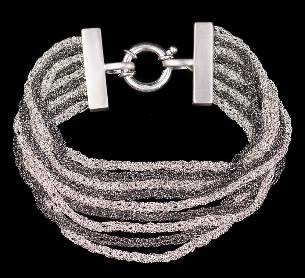 Silver and gray colored multi-stranded silver bracelet