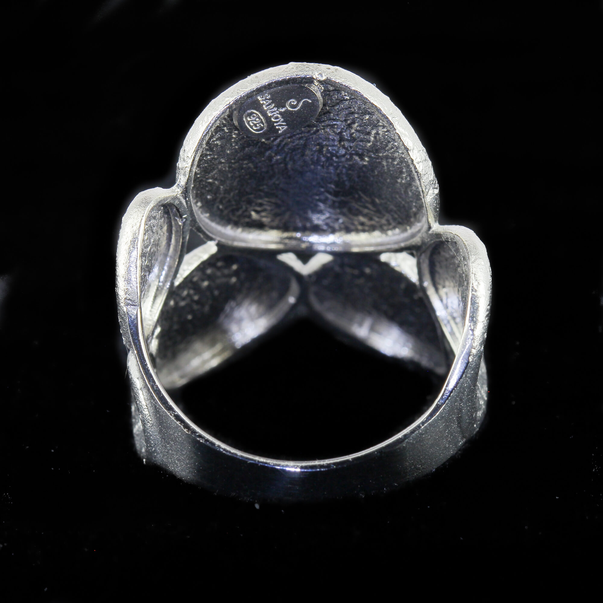 Silver ring with oval-shaped finishes