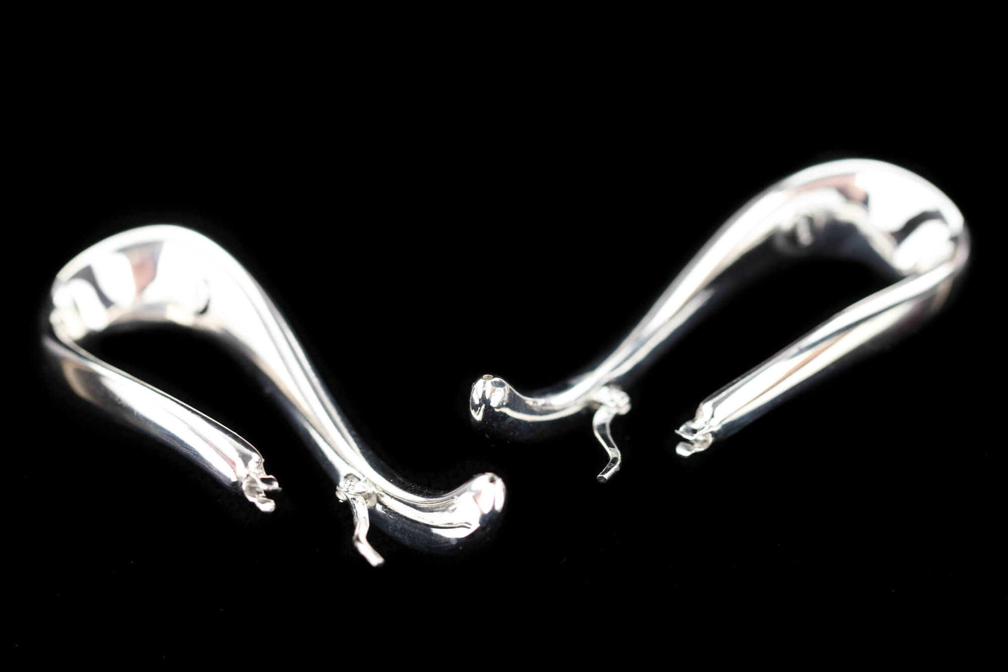 Silver and polished Infinity Creoles. Sanjoya