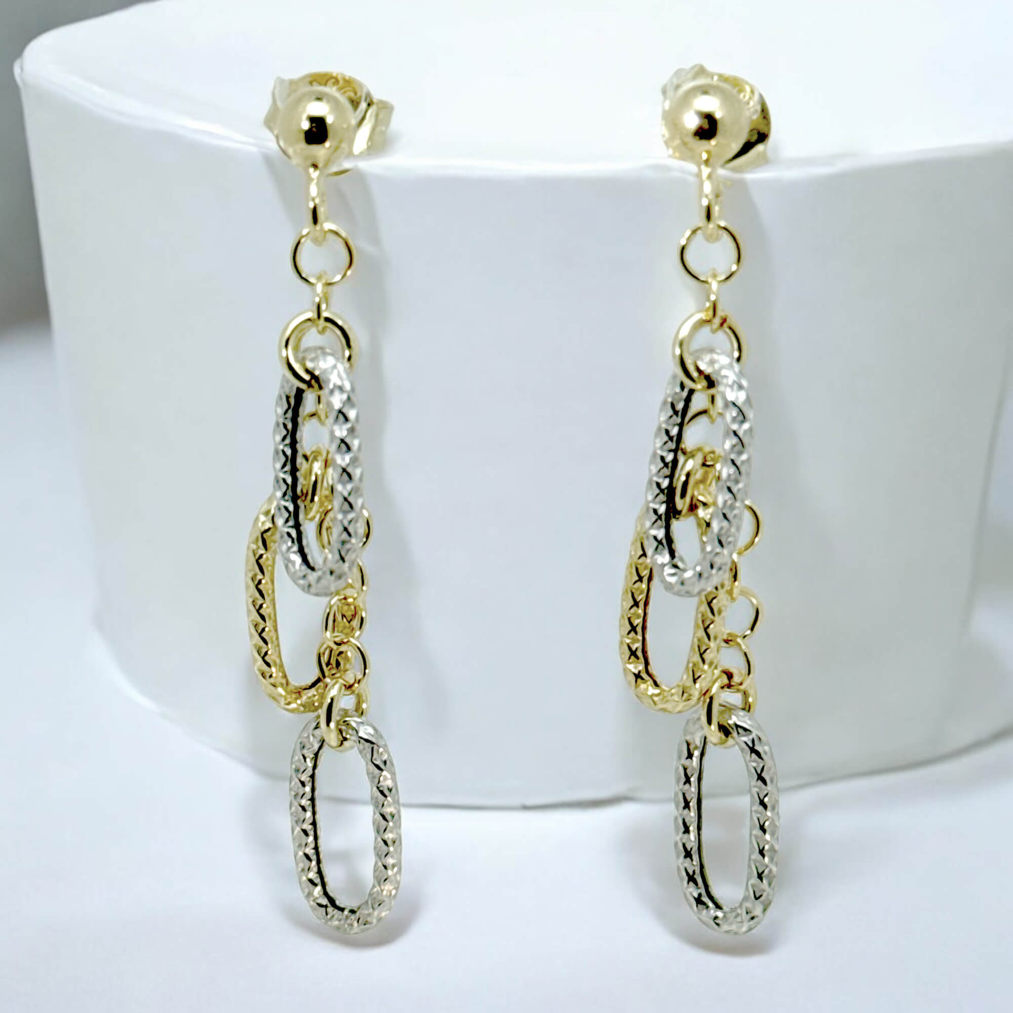 Decorated gold-plated earrings with two-tone pendants