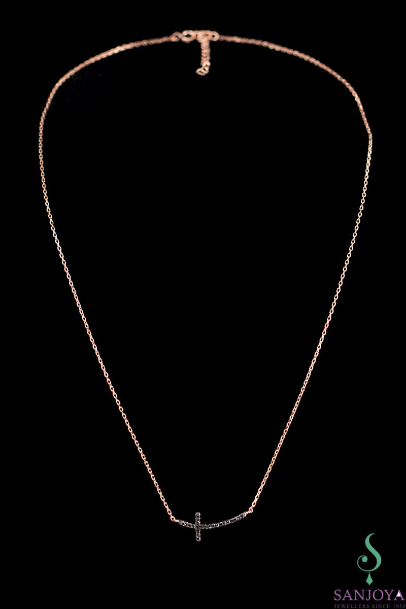 Rose gold necklace with a cross of black zirconia stones