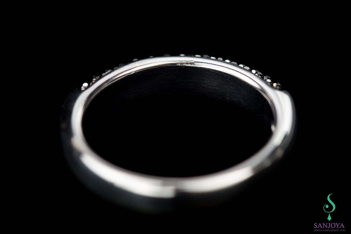 Silver ring with black sparkles