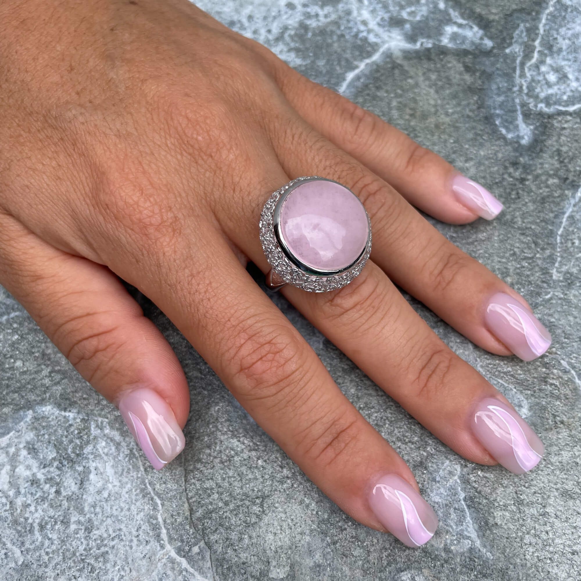 Edited silver ring with a pink quartz stone