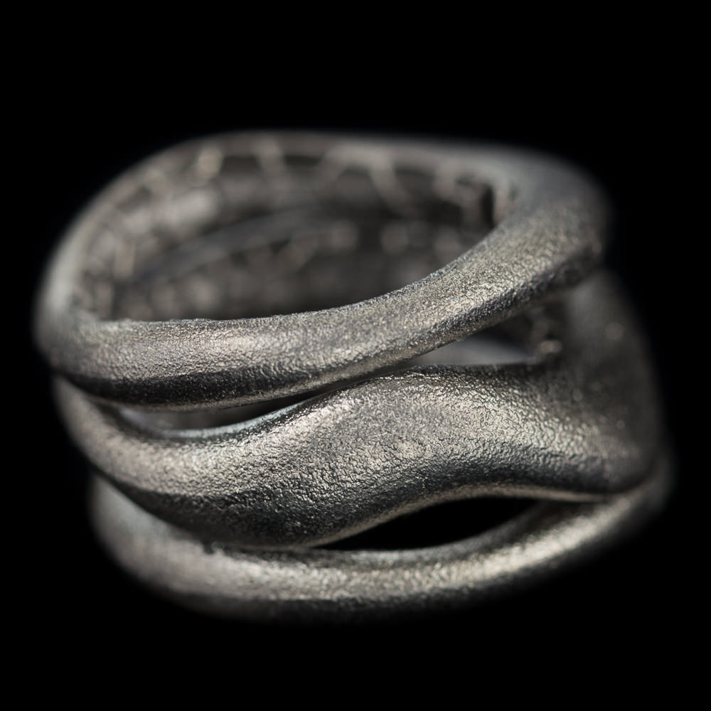 Separate matte ring consisting of three connected rings of dark gray sterling silver. Trendy ring fitting with many jewelry. Also available in the gold-plated, silver and in a tricolor variant. From the Sanjoya collection