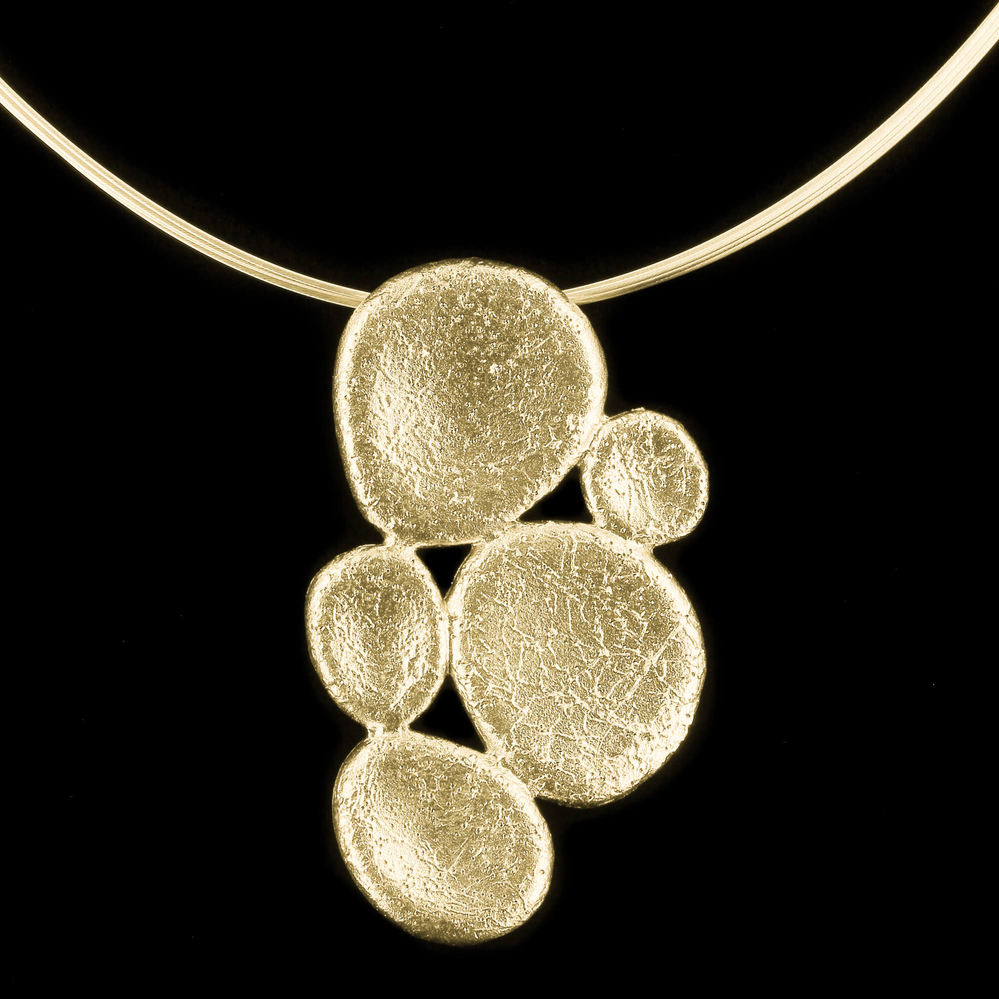 Gold-plated oval-shaped pendant; diamond