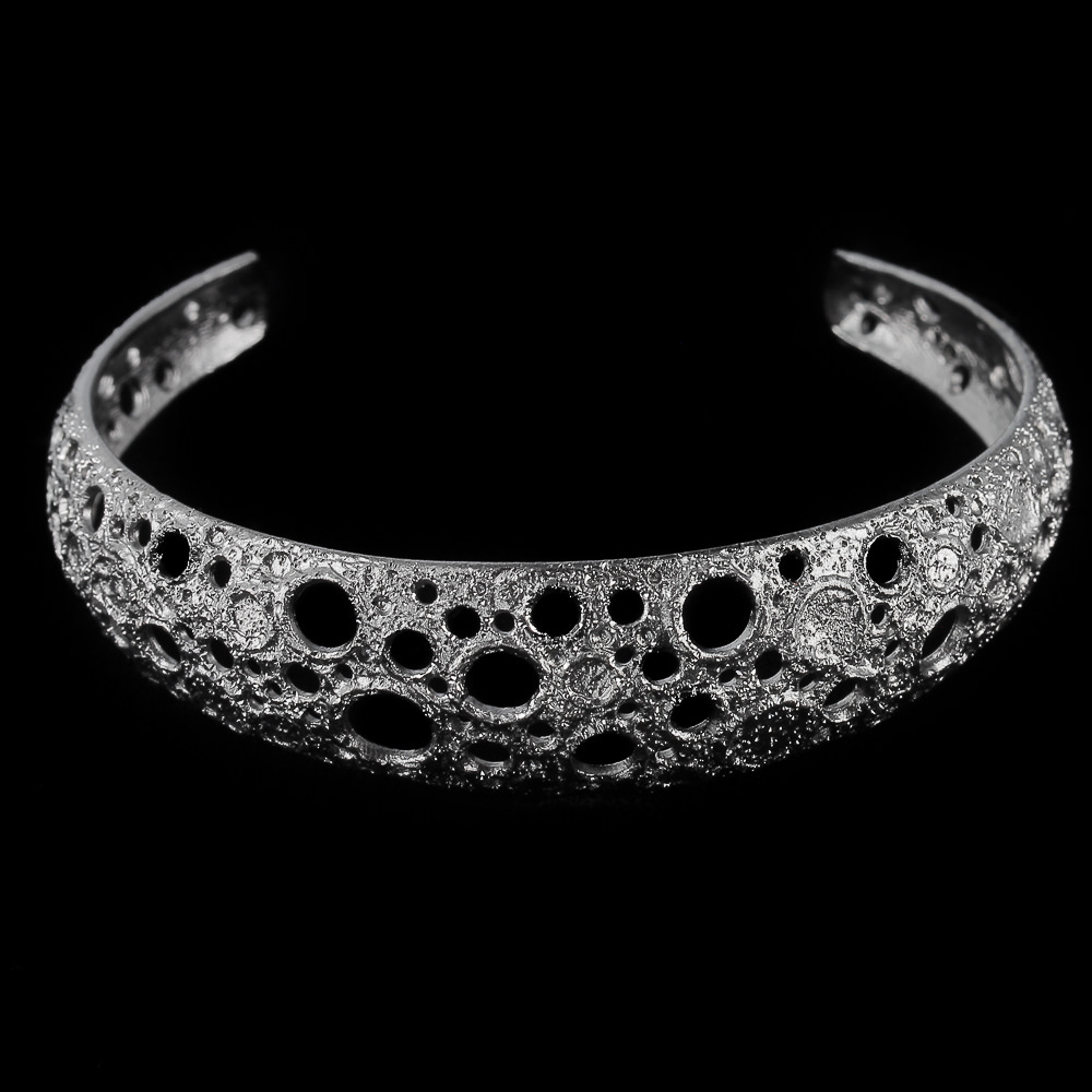 Narrow gray and silver bracelet with machined flare